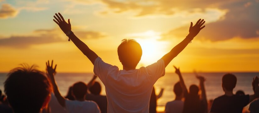 Beach sunset celebration; people rejoice; golden hour; ocean background