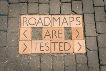 Roadmaps Are Tested Inscribed on Cracked Paving Tiles
