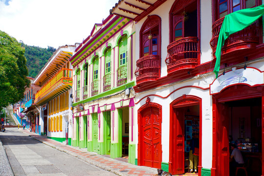 Colorful facades of the small tourist town of Jeric&oacute;, with a cafe in the foreground, in the coffee region.
