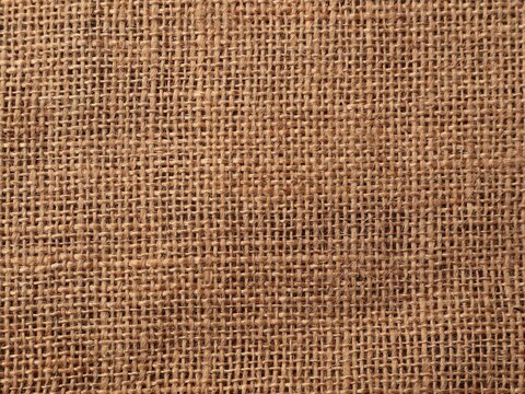 Brown burlap fabric texture close-up background. perfect for rustic backgrounds, textile industry concepts, or organic design element