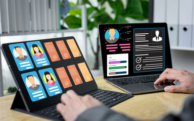 Businessmen use online checklist templates for HR management, reviewing digital recruitment documents and employee qualifications to express efficient talent selection through modern HR applications.