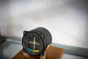 Artificial horizon indicator showing vintage aircraft attitude