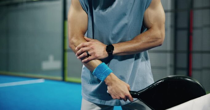 Man, hands or elbow pain with injury on padel court for sport accident, emergency or muscle tension. Active, tennis player or sore bone with bat or strain for joint inflammation, sprain or pressure