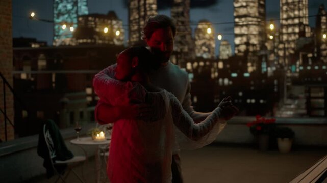 Young Couple Shares a Tender Slow Dance After Dinner. Romatic Dinner, First Day and Future Relationship. Boyfriend and Girlfriend Enjoying Moment of Love with Night City View