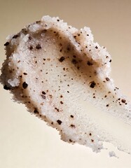 Hyper-realistic studio photography of cosmetic textures, swatch of a white sugar scrub with coffee grounds
