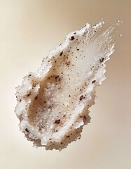 Hyper-realistic studio photography of cosmetic textures, swatch of a white sugar scrub with coffee grounds