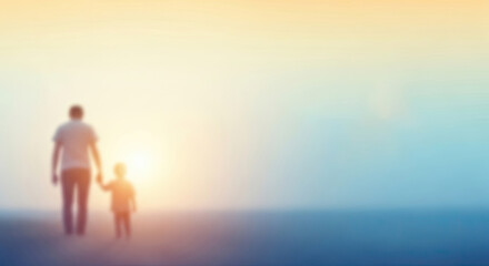 Fototapeta premium A man and a child walking towards the sun on a beach.
