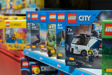 Obraz premium Lego products on a shelf in a shop. A close-up of the Lego logo on a box. Various LEGO boxes are neatly arranged on store shelves, ready for purchase. Minsk, Belarus - March 4, 2025