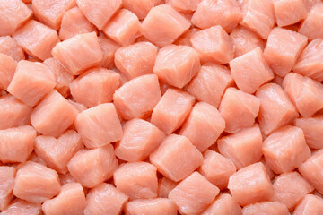 Tightly packed raw chicken breast texture background