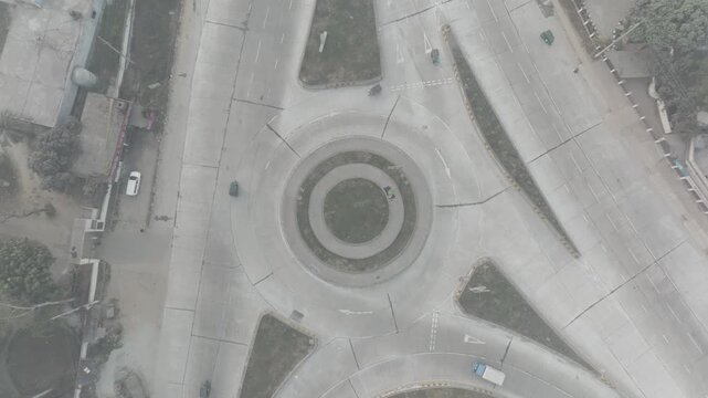 Top down aerial view of Banani Mor roundabout with light traffic in Bogura, Bangladesh