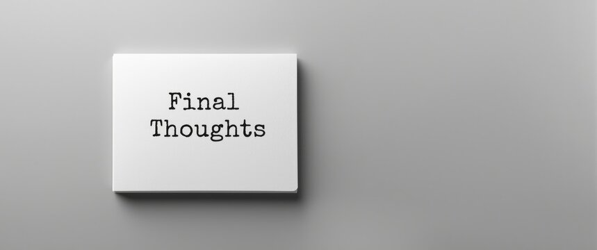 Closing Remarks text on a white notebook, front perspective against a gray backdrop