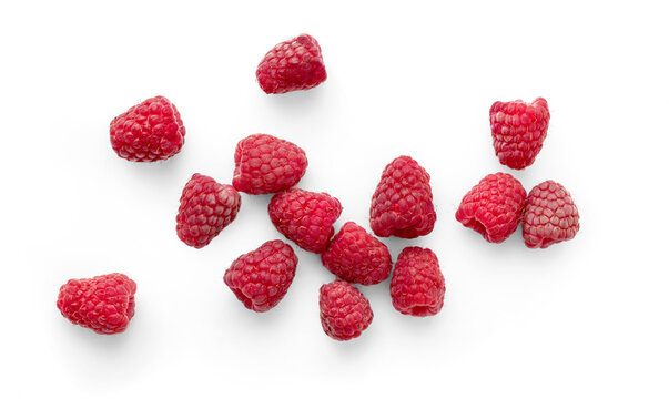 Vibrant Raspberries in Close-Up on a White Background. Top view of scattered raspberries isolated.