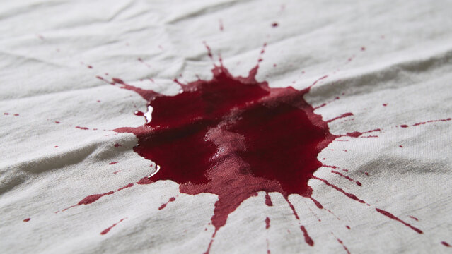 Dramatic Blood Splatter On White Fabric Background With Texture