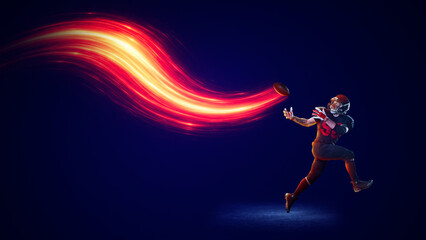 Dramatic composition. American football receiver catching ball with fiery energy wave on dark background. Concept of focus emotion, precision, teamwork, sports marketing, modern visual storytelling. © master1305