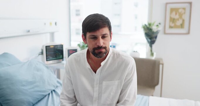 Thinking, patient and man in hospital room, waiting and stress for appointment, anxious and illness. Healthcare, delay and impatient for checkup, reflection and person with sickness on bed in clinic
