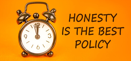Honesty is the best policy symbol. Concept words Honesty is the best policy on beautiful orange paper. Beautiful orange background. Alarm clock. Business honesty is the best policy concept. Copy space
