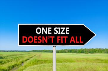 One size does not fit all symbol. Concept words One size does not fit all on beautiful black road sign. Beautiful blue sky field background. Business one size does not fit all concept. Copy space.