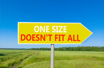 One size does not fit all symbol. Concept words One size does not fit all on beautiful yellow road sign. Beautiful blue sky field background. Business one size does not fit all concept. Copy space.