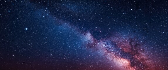 Fototapeta premium Stars flashing in the night sky with a nebula galaxy in the background of blue and purple cosmos