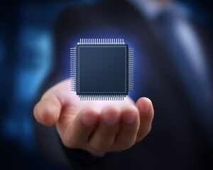 microchip floating over businessman's hand