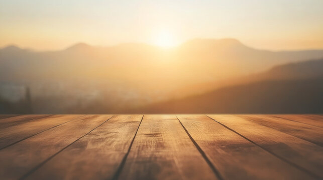 Empty wooden table with sunrise mountain background