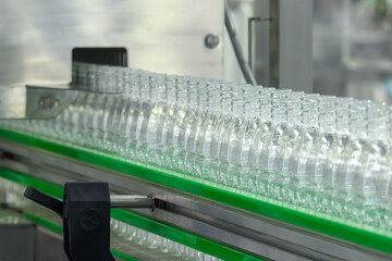 Drinking Water Production Process on Conveyor Belt in Bottling Plant