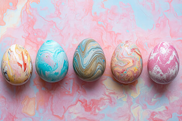 A vibrant display of five marbled Easter eggs in various colors, set against a soft pastel background, perfect for spring celebrations.