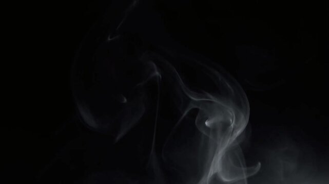 Smoke swirling against a dark background