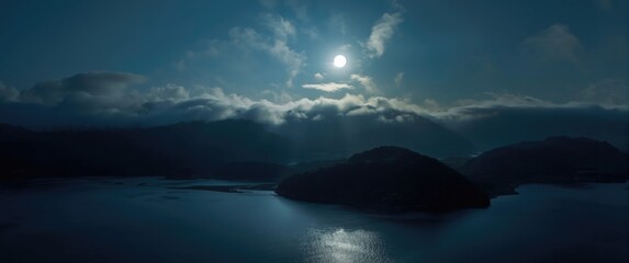 Fototapeta premium Emerald Reservoir under a quiet moonlit sky with a sea of clouds and surrounding peaks in Xindian District, New Taipei City, Taiwan