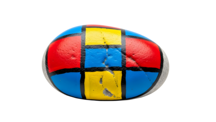 Stone painted with primary colors geometric grid pattern, isolated on white background