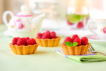 Raspberry mini tart (cupcakes ) on a table