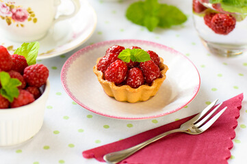 Raspberry mini tart (cupcakes ) on a table
