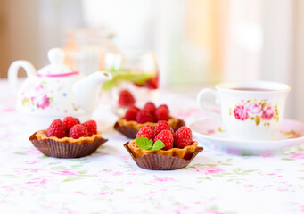 Raspberry mini tart (cupcakes ) on a table
