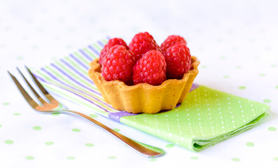Raspberry mini tart (cupcakes ) on a table