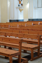 Rows of empty pews inside a church. Mass, Christian religion, Holy Week. Christian Easter.