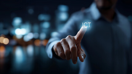 Defocused business person using virtual touchscreen with ICT abbreviation information communication technology smart city concept future urban development autonomous building