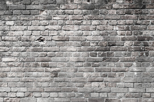Brick background. Surface of old grey brick wall.