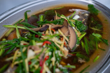 Streamed Seabass Fish with Soy Sauce served on plate. Thai food