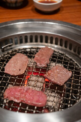 Various type of Japanese style sliced rare beef meat on charcoal grill