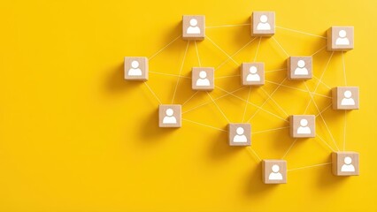 Wooden blocks featuring people icons connect with strings to illustrate network collaboration and teamwork.
