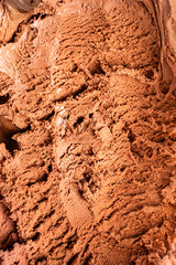 Obraz premium Scooped chocolate ice cream or chocolate ice cream background