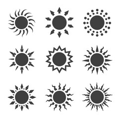 Nine minimalist sun silhouette icons with varied ray styles, including dotted halos, arrows, spikes and wavy beams; monochrome solar symbols for weather, summer and branding designs.