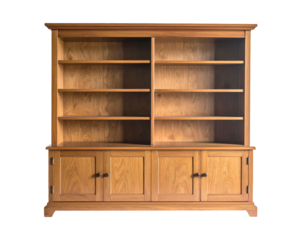 A large, wooden bookshelf cabinet with multiple shelves and lower storage doors, isolated
