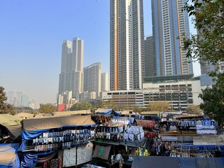 Dhobi Ghat open-air laundry district with high-rise skyline in Mumbai, Maharashtra, India.
