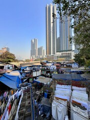 Dhobi Ghat open-air laundry district with high-rise skyline in Mumbai, Maharashtra, India.

