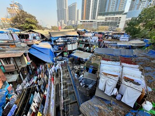 Dhobi Ghat open-air laundry district with high-rise skyline in Mumbai, Maharashtra, India.
