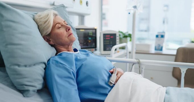 Sleeping, sick and old woman in hospital bed, recovery and healing with healthcare. Pensioner, mature patient and person with fatigue, resting and post surgery with insurance and rehabilitation
