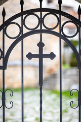 Old church gate with holy cross of Christianity. Christian church gate