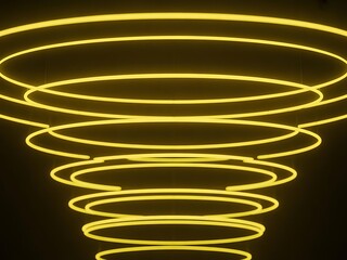 Yellow neon light spirals in a dynamic, swirling abstract pattern against a dark background creating a mesmerizing visual effect