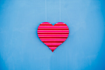 metal cut out of a heart on string